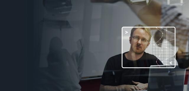 Blue-tinted background of a team meeting with a bright inset of a person listening.