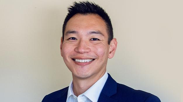 portrait of Daren Eiri in front of cream colored wall