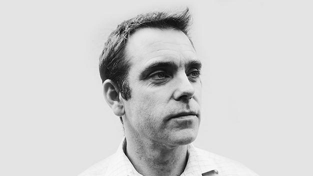 black and white portrait of Wayne Jones looking off to the side