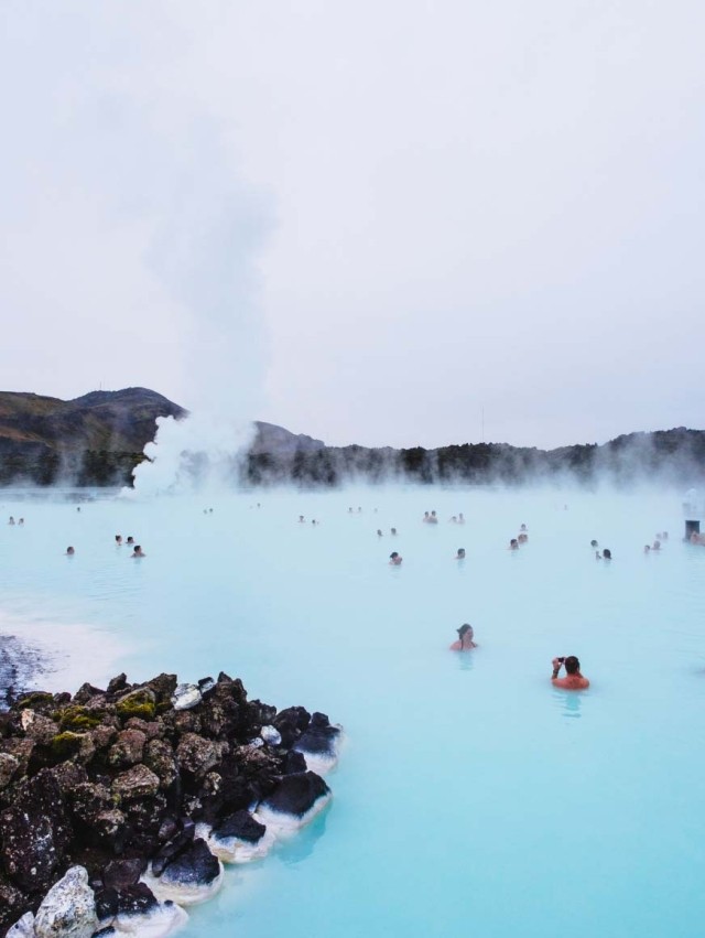A steam blue lagoon with people swimming