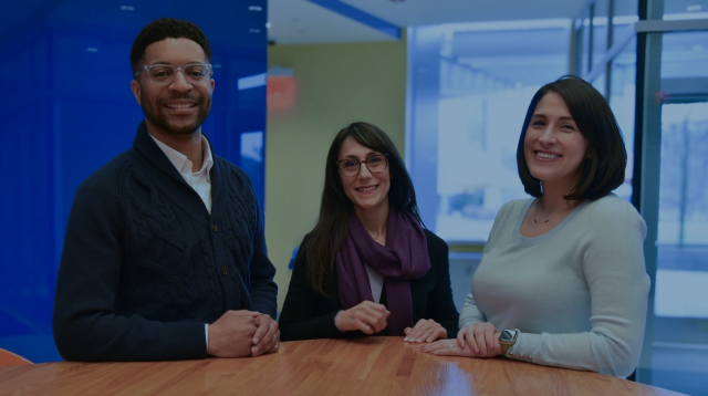 Regeneron data science team members Regis A. James, Jordan Leao, and Jennifer Michel collaborating on the MAGNETRON AI platform.