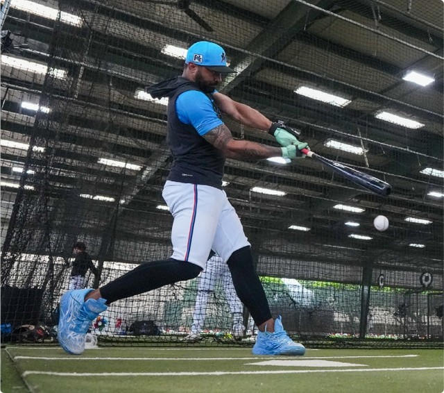 A Miami Marlins player swinging a bat