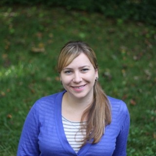 portrait of Mine Çetinkaya-Rundel outside in front of grass