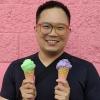 Daniel Chen holdiing green and purple ice cream cones