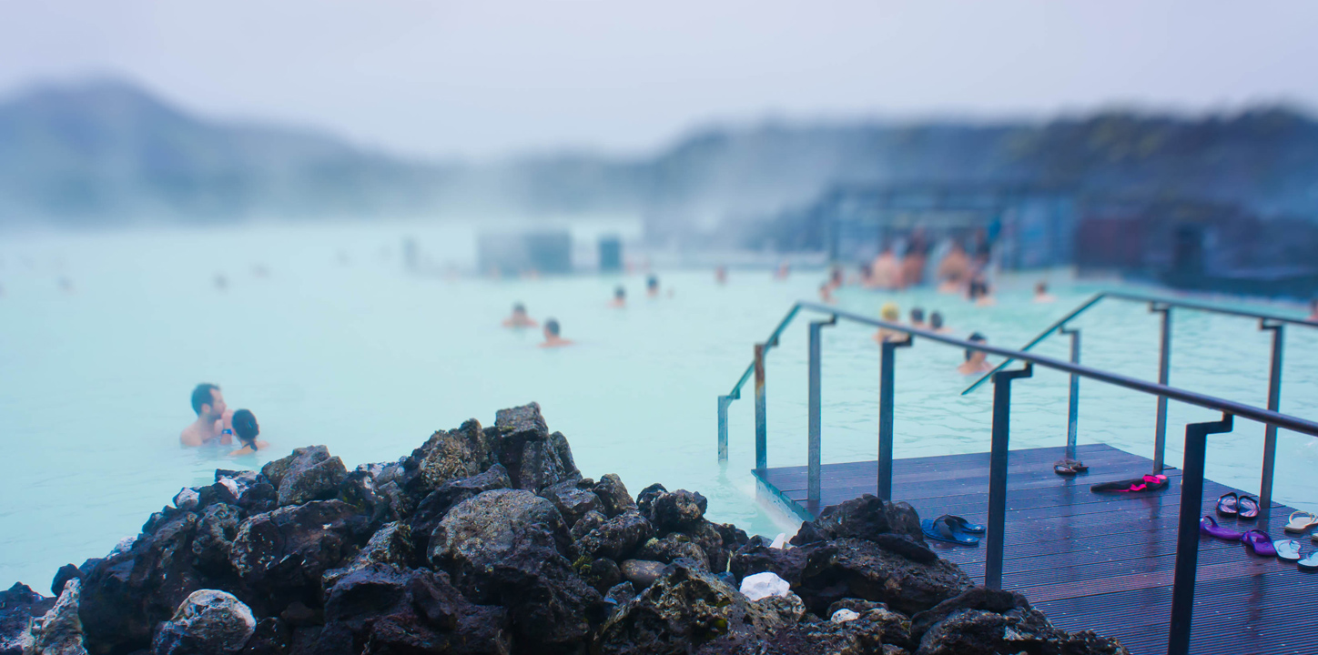 people soaking in a geothermic pool in Iceland