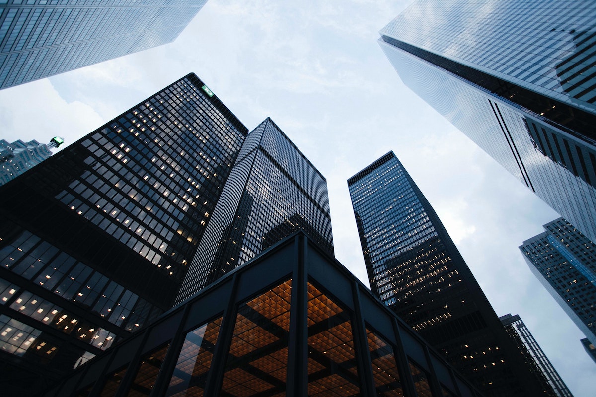 Low angle photo of city high-rise buildings during daytime